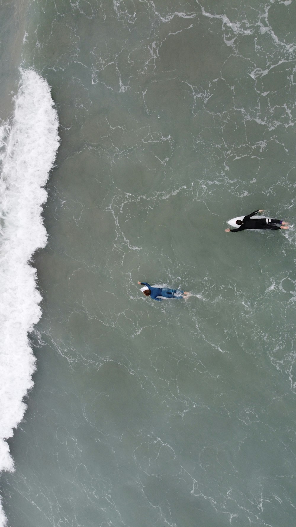 a couple of people are in the water