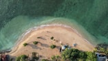 an aerial view of a sandy beach and ocean