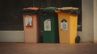 a group of trash cans sitting next to each other