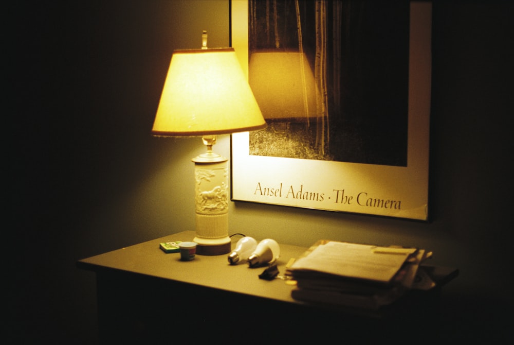 a lamp and a book on a table