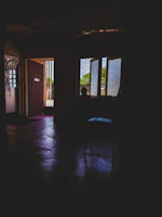 Wide shot of a partially framed room with natural light streaming through.