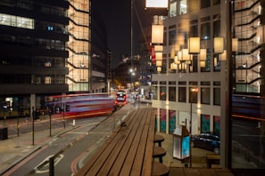 View from the city suite window overlooking a vibrant London street scene.
