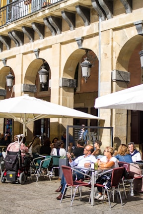 An outdoor café filled with people enjoying their day.