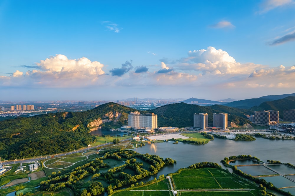 an aerial view of a city and a lake