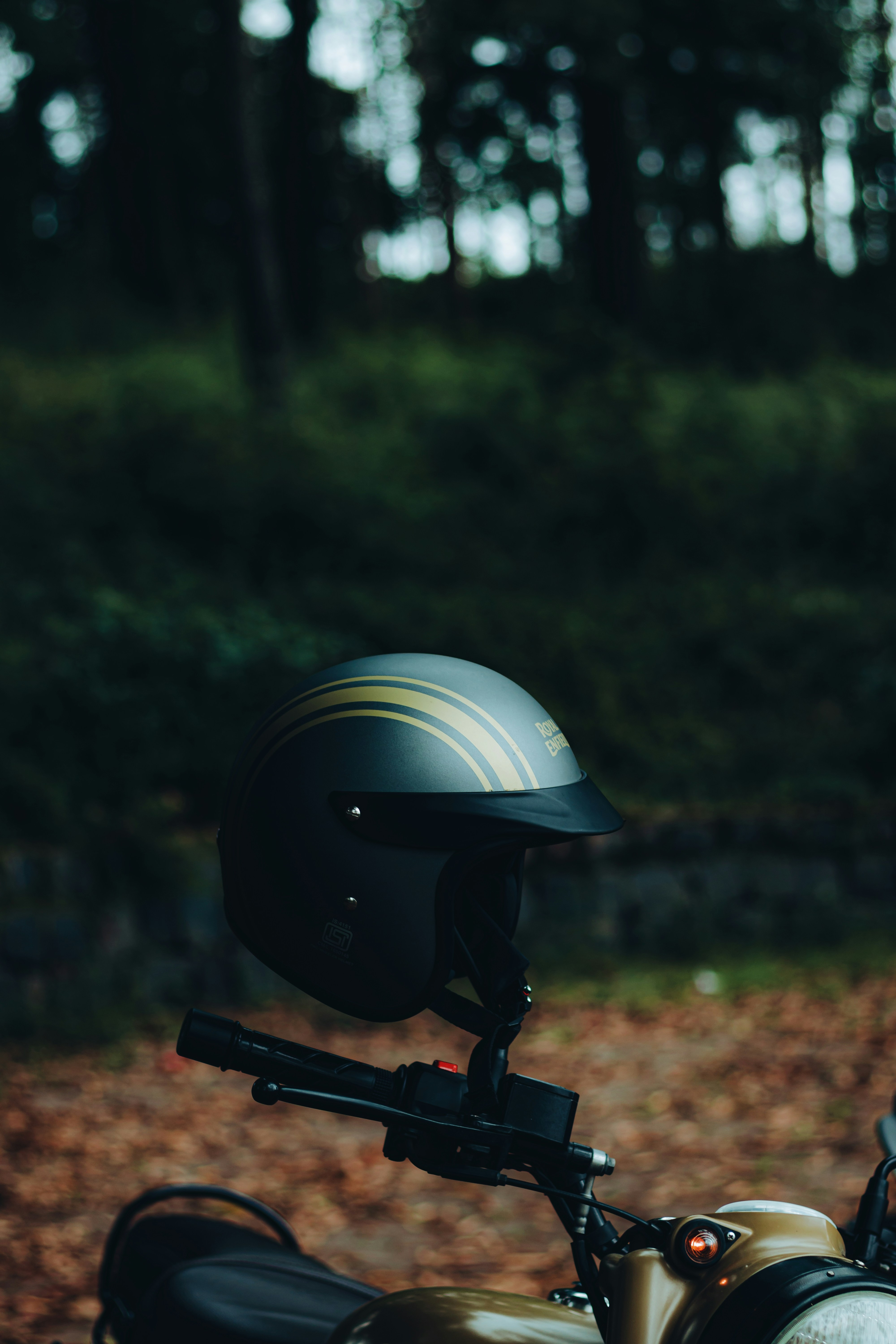 a motorcycle with a helmet on the back of it