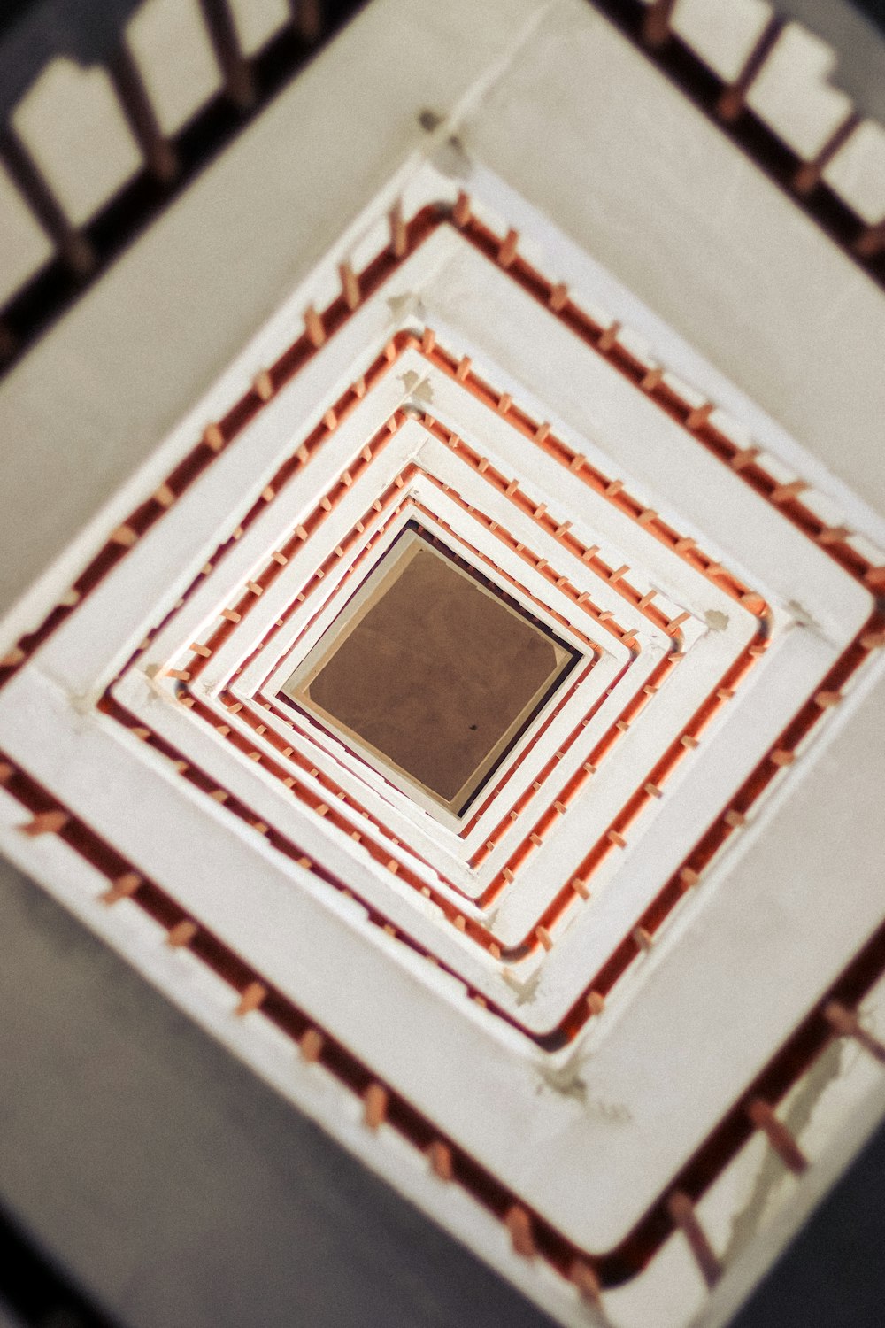 a square shaped ceiling with a brown square in the center