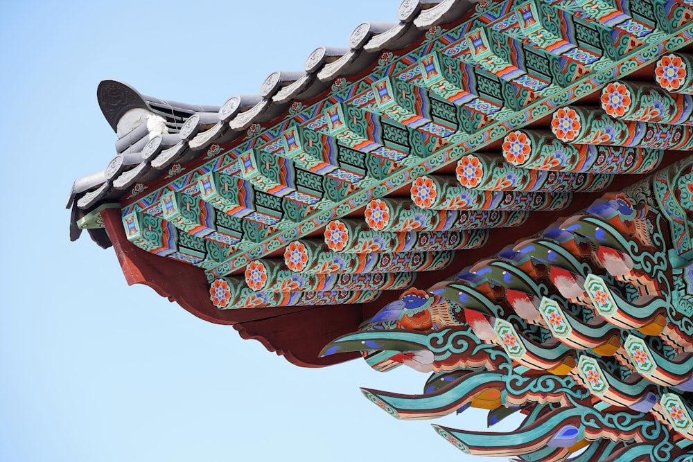 a close up of a building with a sky in the background