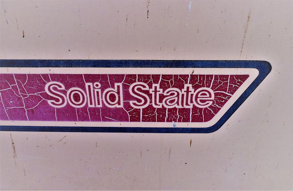 a red and white sign that says solid state