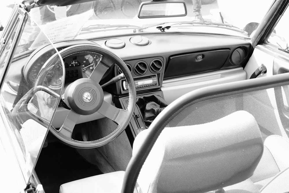 a black and white photo of a car dashboard