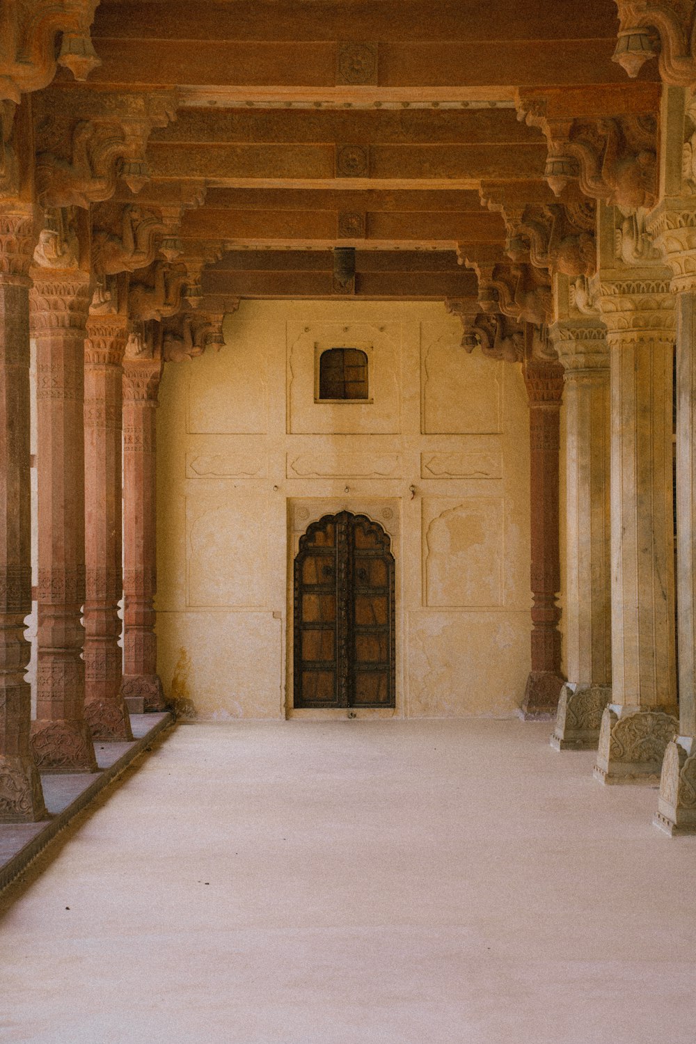 a large building with columns and a door