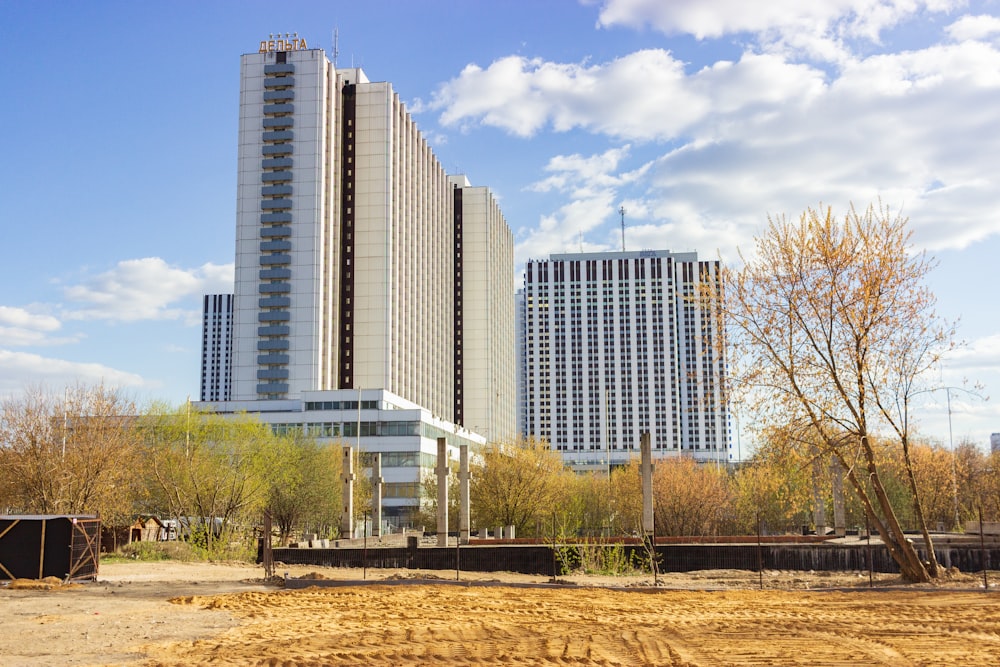 a very tall building next to some very tall buildings