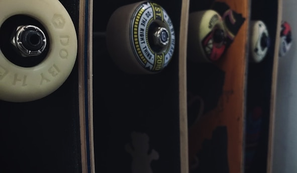 Close-up of skateboarding supplies including wax and decks displayed at Luna Skate