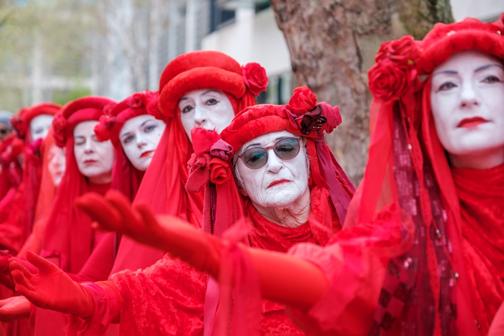 a group of people dressed in red and white