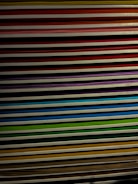 Stack of printed PDF documents with colorful covers