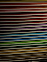 An assortment of colorful paper sheets stacked neatly.