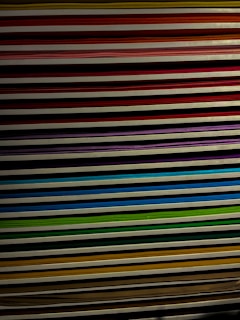 Stack of colorful printed documents neatly arranged on a table.