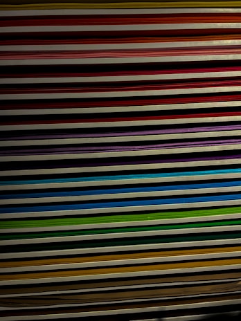 Stack of colorful printed documents neatly arranged on a table.