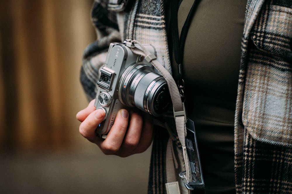 a person holding a camera in their hand