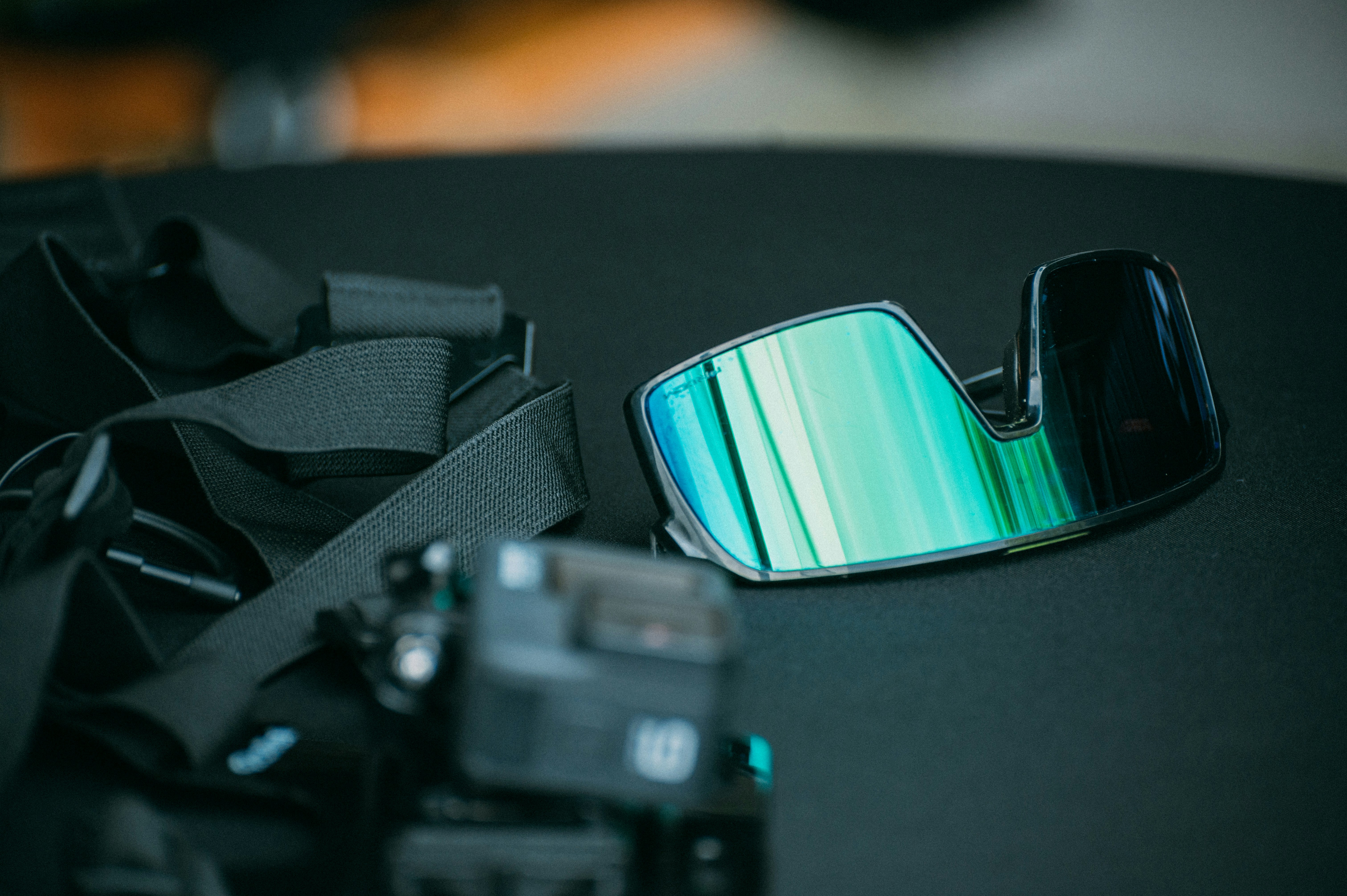 a close up of a camera and a camera strap