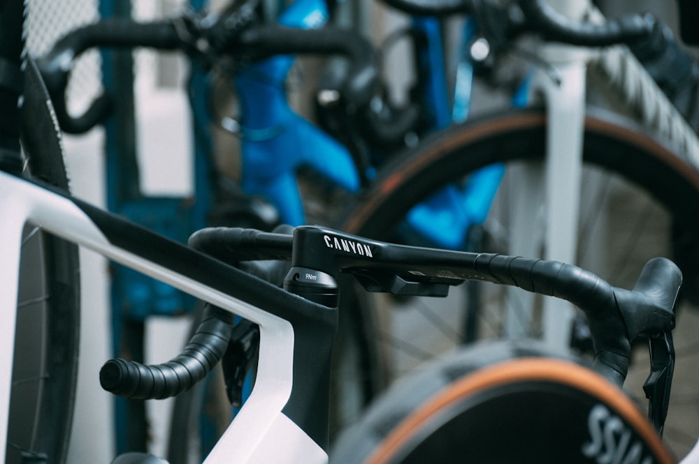 a close up of a bike rack with bikes in the background