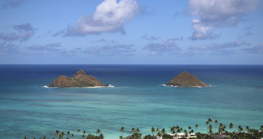 a couple of small islands in the middle of the ocean