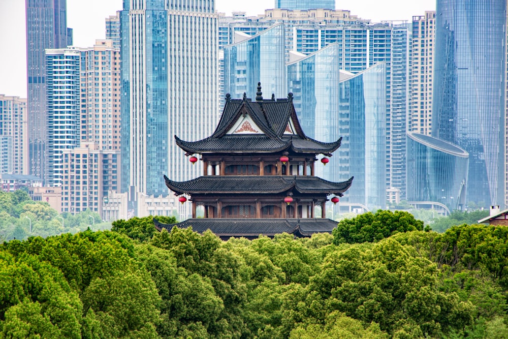 a tall building sitting in the middle of a forest