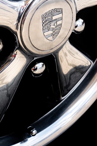 Close-up of a gleaming Porsche Cayenne after a ceramic coating treatment, highlighting its glossy finish.