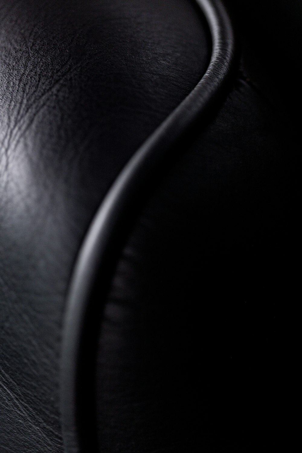 a close up of a black leather seat