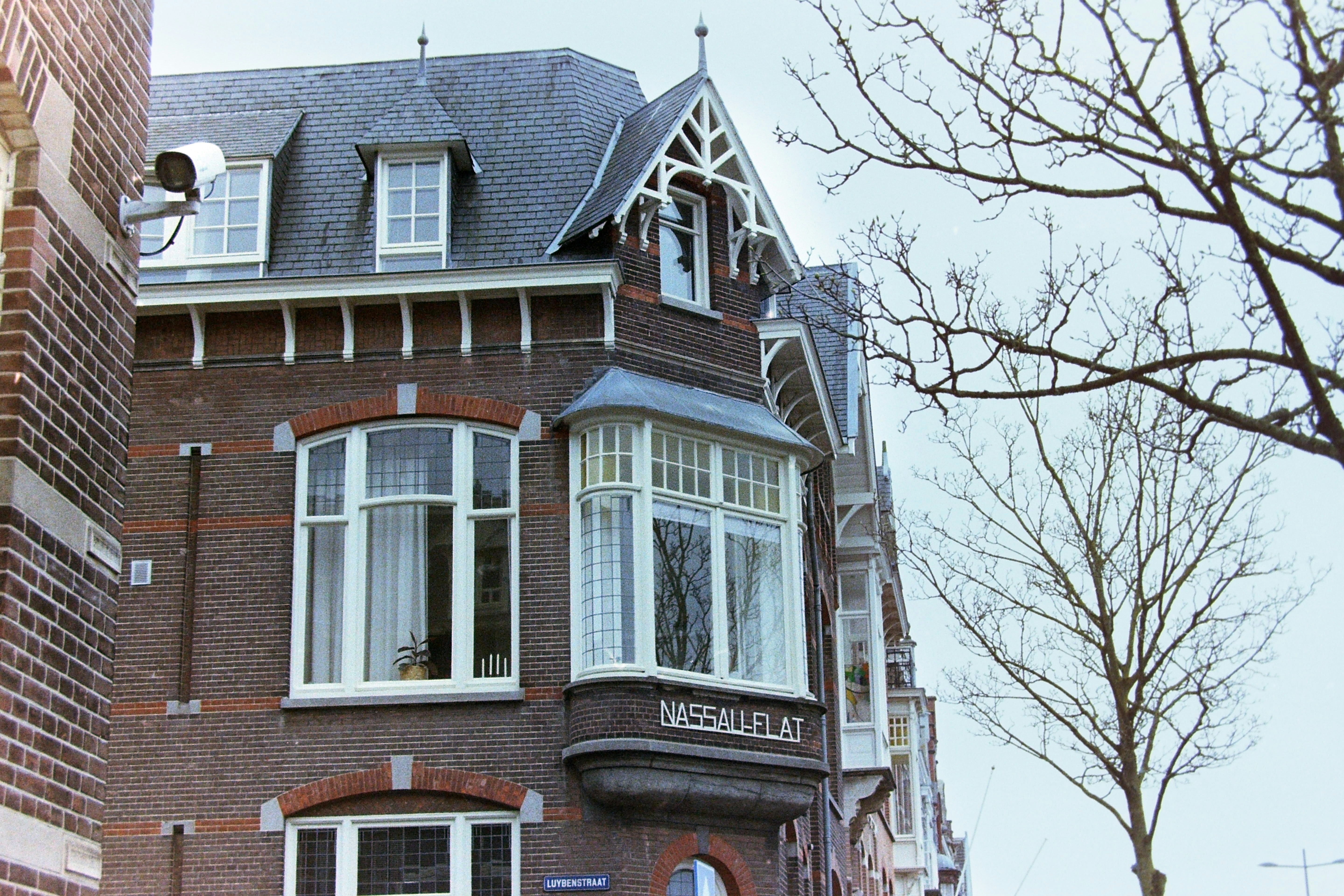a large brick building with a clock on the front of it