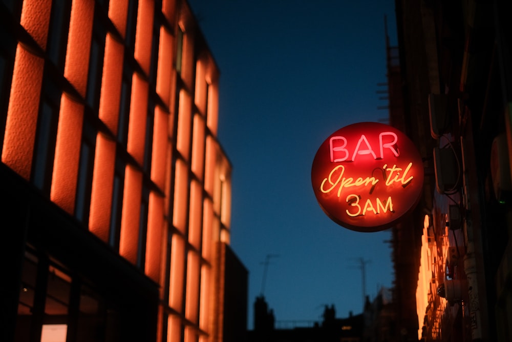 a neon sign on the side of a building