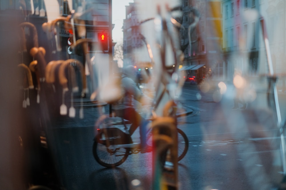 a blurry photo of a bicycle and traffic lights