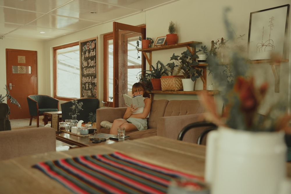 a woman sitting on a couch in a living room