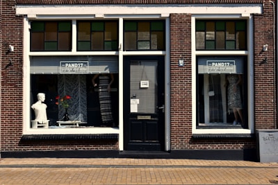 a store front with a mannequin in the window