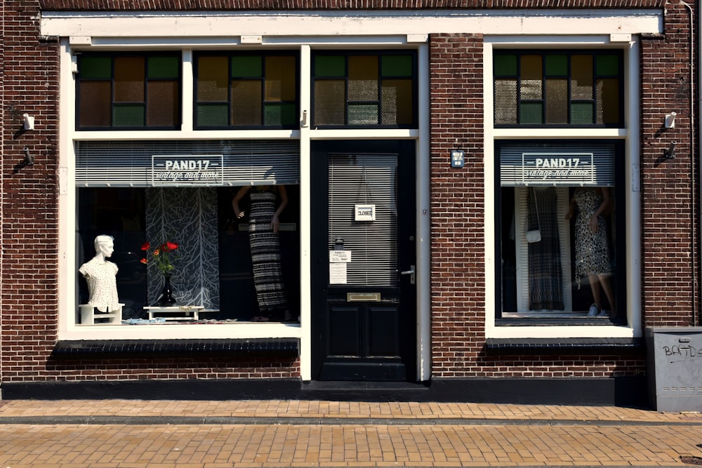 a store front with a mannequin in the window