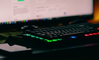 a computer keyboard sitting on top of a desk