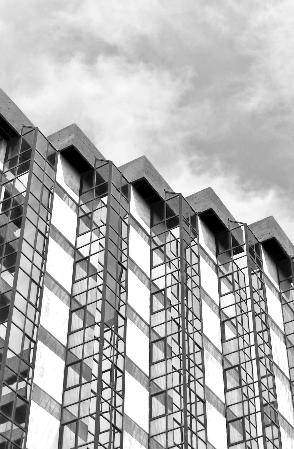 a black and white photo of a tall building