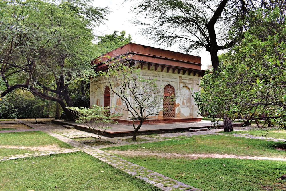 a small building in the middle of a park