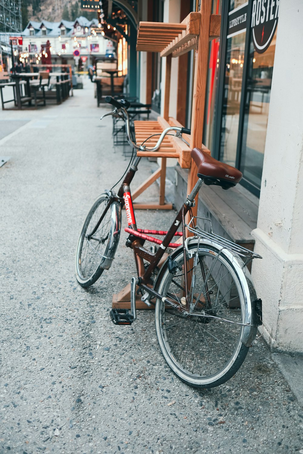 a bicycle parked on the side of a street