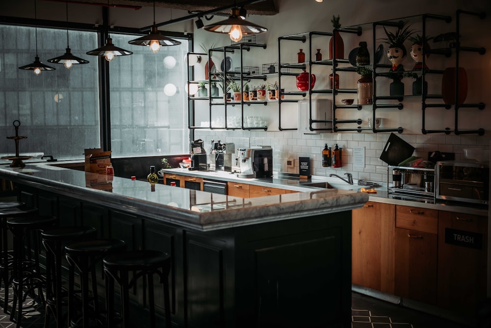 a bar with a bunch of bottles on the wall