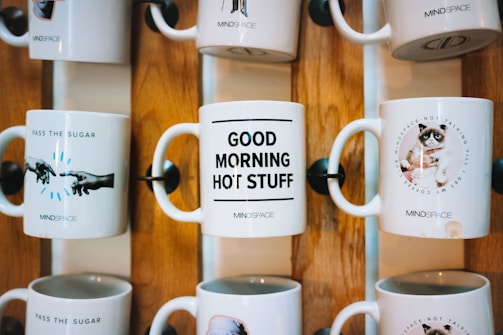 A variety of cute mugs with charming illustrations.