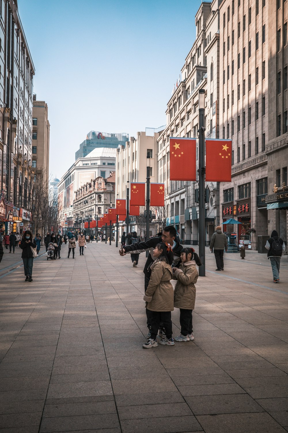 a couple of people that are standing in the street