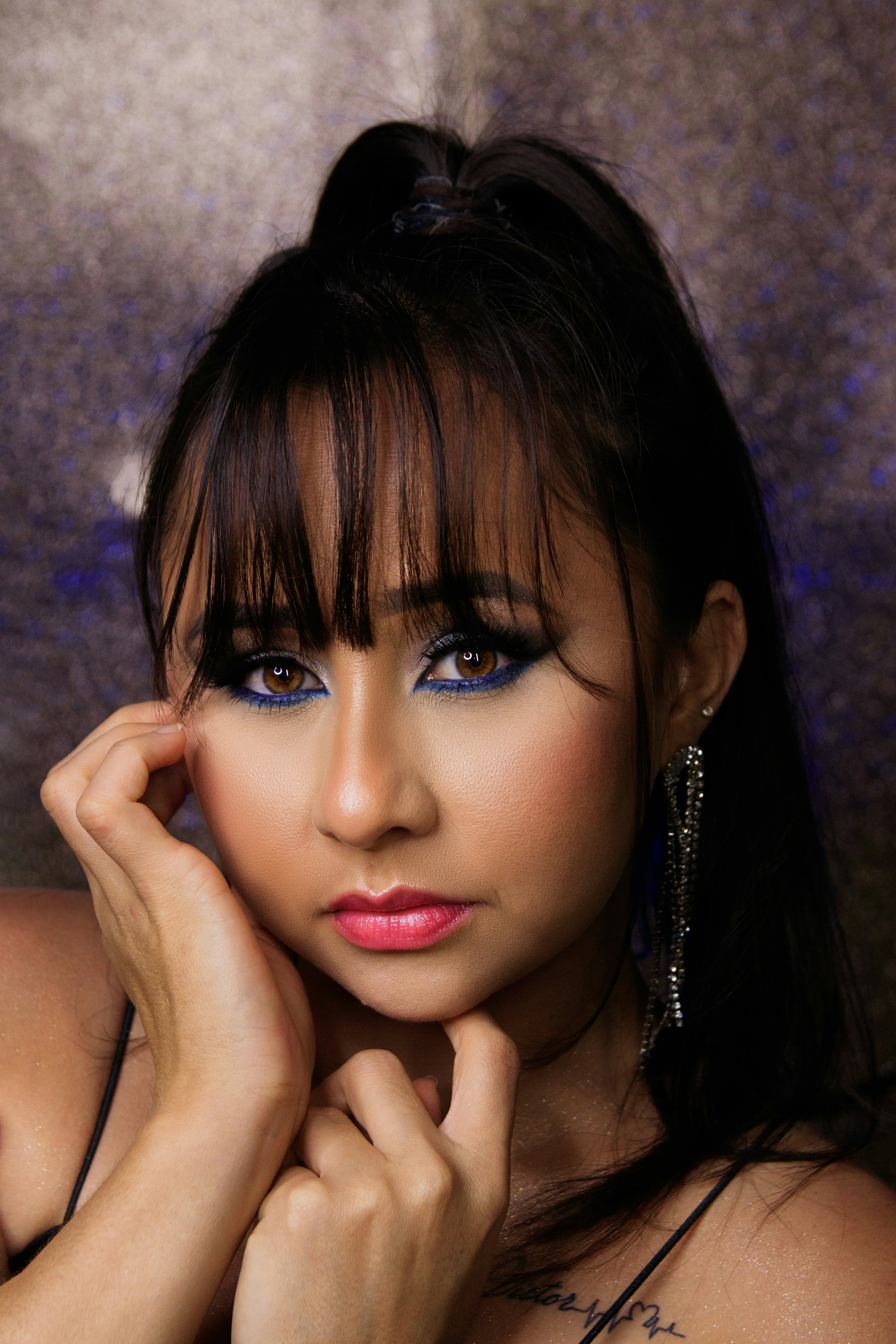 a woman with blue eyes posing for a picture