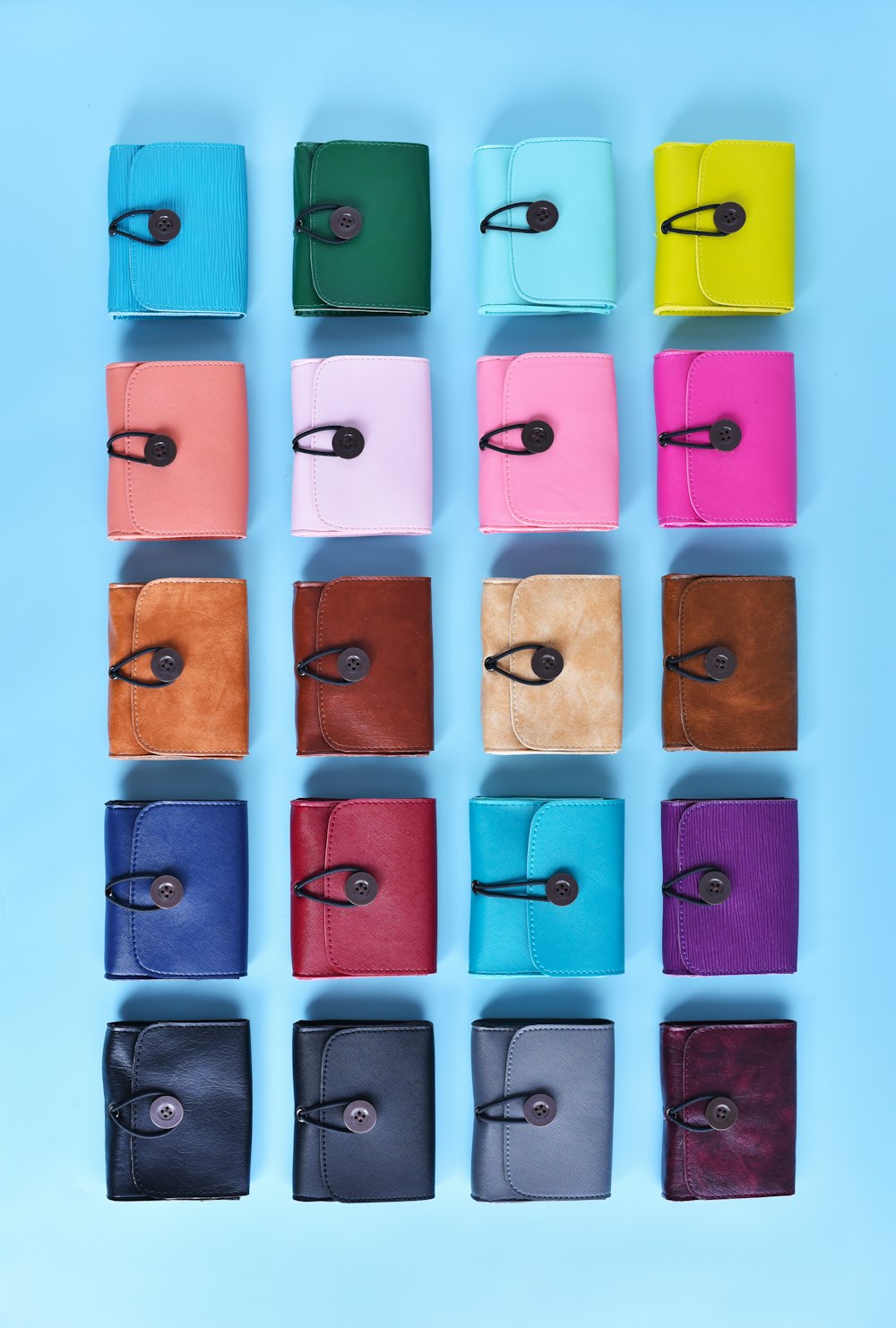 a bunch of different colored wallets tied together
