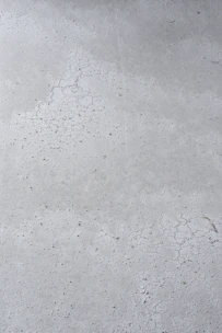 Close-up of smooth, freshly poured concrete surface ready for construction.
