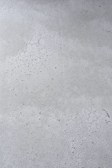 Close-up of concrete sample undergoing high-temperature testing in a laboratory setting.