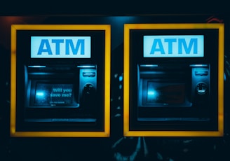 a couple of atm machines sitting next to each other