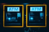 a couple of atm machines sitting next to each other