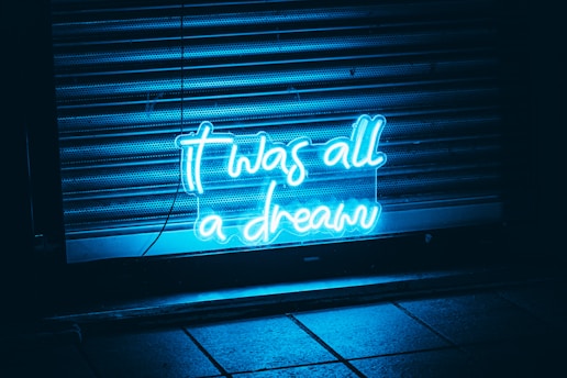 a neon sign that says, it was all a dream