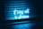 Neon blue text reading 'it was all a dream' is illuminated against a dark backdrop with metal shutters and tiled floor visible.