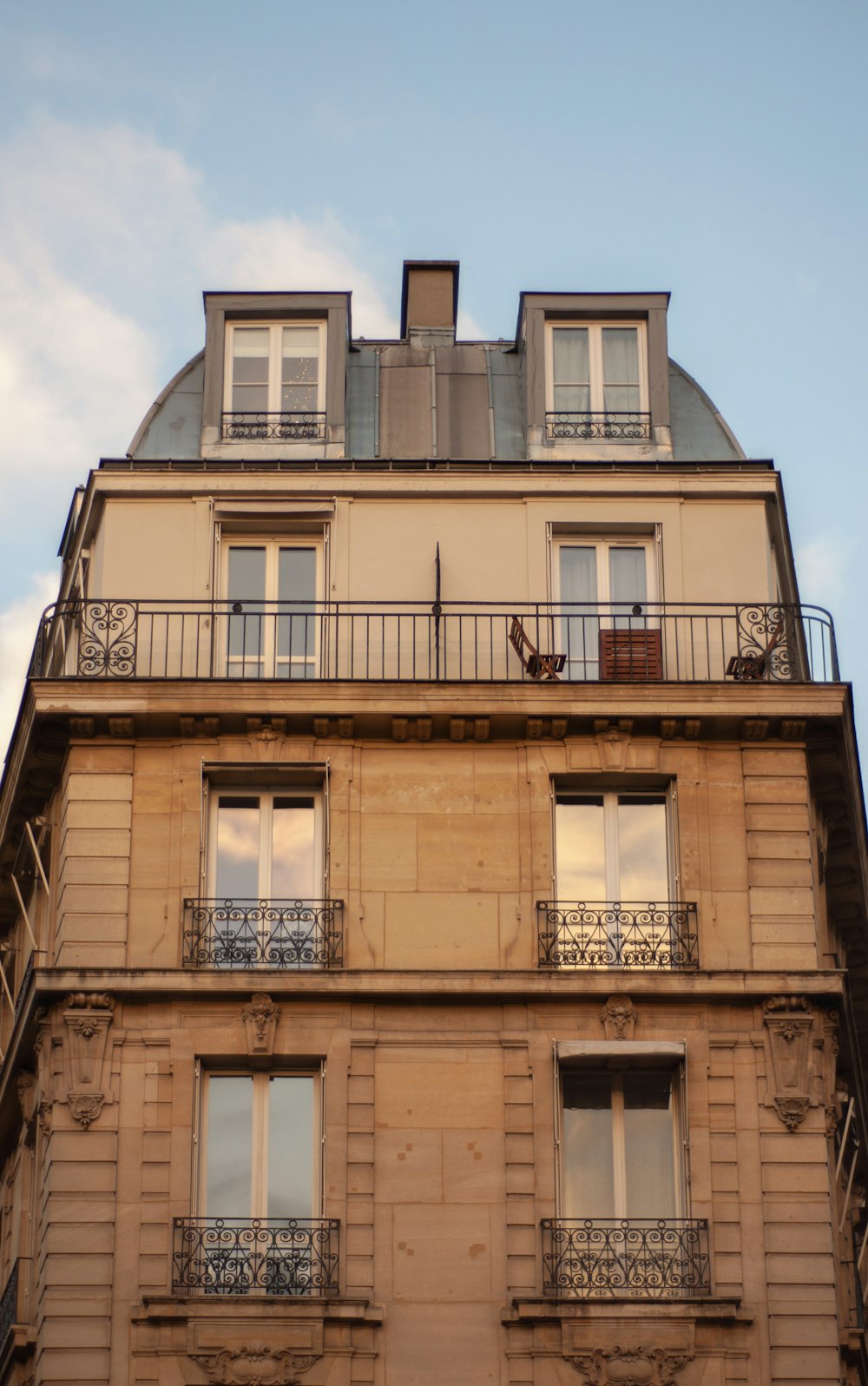 a tall building with balconies and balconies on top